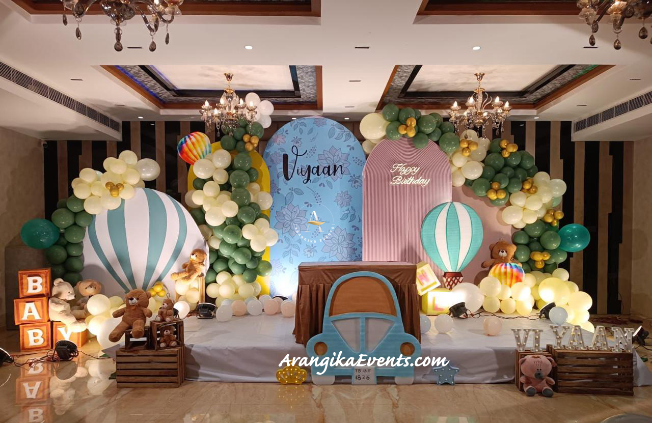 "Birthday decoration setup by Arangika Events – Birthday Event Planners in Hyderabad with teddy bear theme, balloon decorations, hot air balloon props, and stylish stage backdrop for kids birthday party."